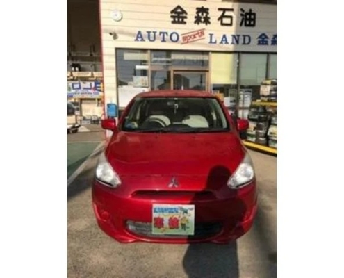 三菱ミラージュの車検入庫車両｜愛知県江南市 金森石油 AUTO LAND店舗前で撮影された赤いコンパクトカー
